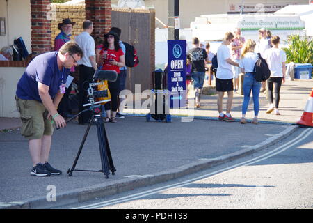 Film professionnel photographe, l'enregistrement à Sidmouth Folk Festival, l'est du Devon, Royaume-Uni. Août, 2018. Banque D'Images