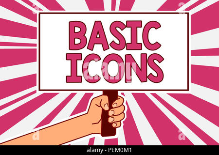 L'écriture de texte de base texte d'icônes. Concept d'affaires de pictogramme ou de l'idéogramme affichée sur l'écran d'un ordinateur ou téléphone Man hand holding poster important pr Banque D'Images