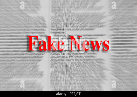 Fake news écrit en rouge avec un article de journal à l'arrière-plan flou Banque D'Images