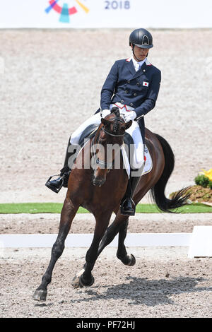 Jakarta, Indonésie. 20e Août, 2018. Kazuki Sado du Japon fait concurrence au cours de l'équipe de dressage équestre lors de la 18e Finale des Jeux Asiatiques à Jakarta, Indonésie, le 20 août 2018. Crédit : Du Yu/Xinhua/Alamy Live News Banque D'Images