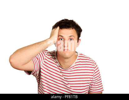 Portrait de jeune homme à la tête de la main avec le choc émotionnel. guy isolé sur fond blanc. Banque D'Images