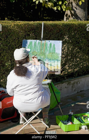 Une peinture de l'artiste dans le Jardin del Marqués de La Vega-Inclán, Alcázar de Séville, jardins Banque D'Images