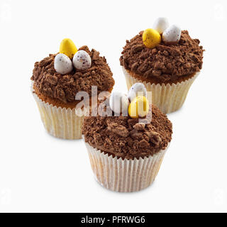 Cupcakes décorés de 'dinosaur' oeufs Banque D'Images