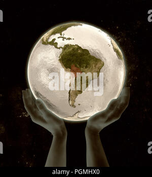 La Bolivie le globe dans les mains dans l'espace. 3D illustration. Banque D'Images