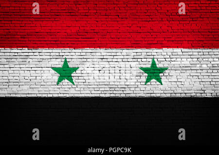 Drapeau national de la Syrie sur un fond de brique Banque D'Images