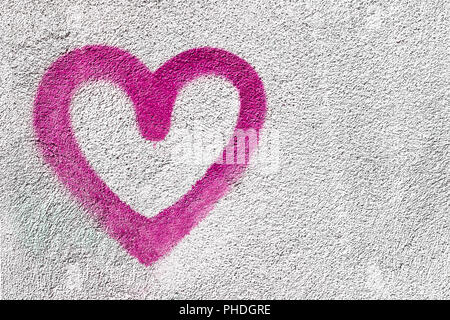 Coeur rose sur le mur Banque D'Images