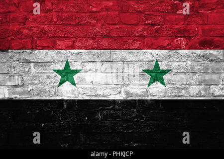 Drapeau de la Syrie sur un vieux mur de briques historique, surface Banque D'Images