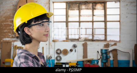 Image composite de female architect wearing hard hat et lunettes de sécurité contre l'arrière-plan blanc Banque D'Images