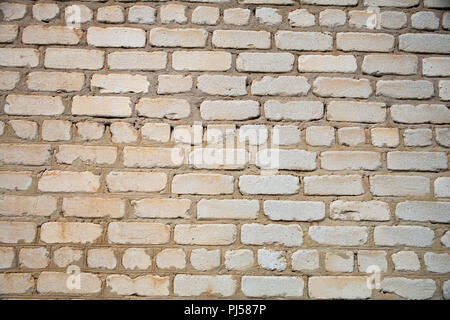 Vieux mur de briques blanches avec du ciment texture coutures Banque D'Images