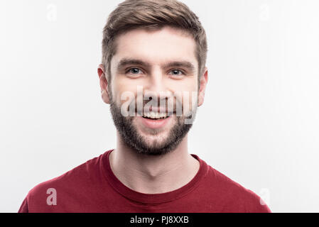 Beau blue-eyed student smiling après une belle journée Banque D'Images