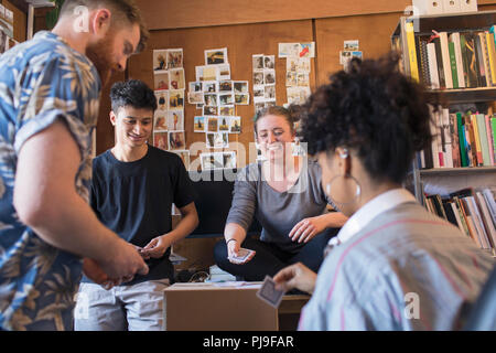 Creative business people playing cards in office Banque D'Images