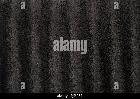 Un tissu en velours noir avec des motifs de peau d'animaux inspirés du serpent bénéficiant d'une texture très détaillée avec un design complexe et une douceur veloutée Banque D'Images