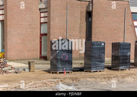 Smiley Graffiti sur chantier de construction. Banque D'Images