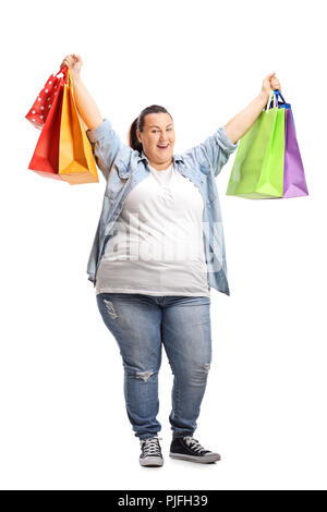 Portrait d'une très grande joie woman with shopping bags isolé sur fond blanc Banque D'Images