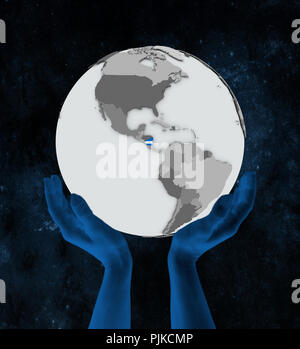 Nicaragua avec drapeau sur le globe dans les mains dans l'espace. 3D illustration. Banque D'Images