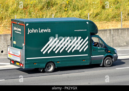 Vue arrière côté & John Lewis & partenaires boutique accueil livraison transport van équipé de levage de la plate-forme de la porte arrière de la conduite sur autoroute M25 Essex England UK Banque D'Images