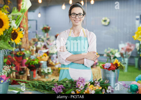 Woman posing in Flower Shop Banque D'Images