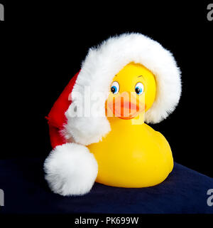 Yellow rubber ducky wearing Santa Hat Banque D'Images