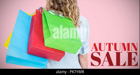 Image composite de woman holding shopping bags Banque D'Images