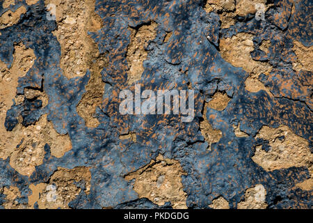 Mur en pierre jaune et bleu foncé peinture pèle du mur/grunge texture background Banque D'Images