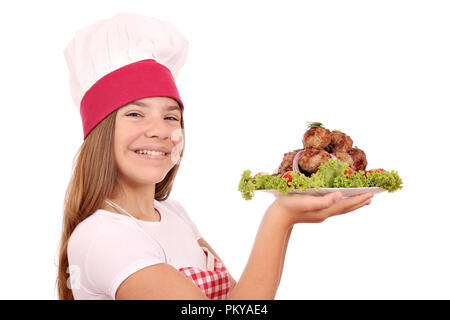 Belle happy little girl cook avec des boulettes de viande sur la plaque Banque D'Images