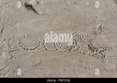 Mot écrit dans le sable, de Saint- Peter-Ording, Schleswig-Holstein, Allemagne Banque D'Images