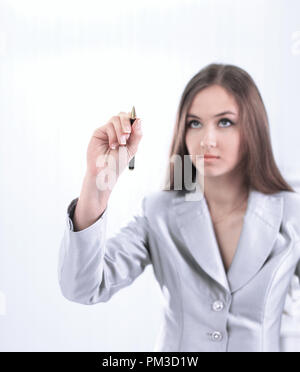 Confident business woman pointing at a point virtuel. Banque D'Images