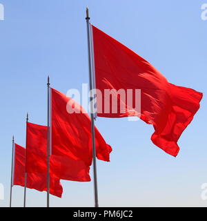 Quatre drapeaux rouges en Chine (Place Tiananmen) Banque D'Images
