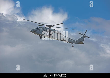 USNAVY MH-60 Seahawk hélicoptère sur entraînement au tir de l'exercice dans certaines limites, de prendre l'avion à partir de la base de la RAF à Lossiemouth dans Moray, en Écosse. Banque D'Images