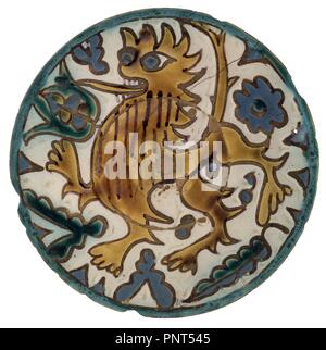Platon CUERDA SECA DE SEVILLANO DECORADO CON UN DRAGON AMARILLO Y HOJAS - siglo XVI. Lieu : INSTITUTO VALENCIA DE DON JUAN-COLECCION. MADRID. L'ESPAGNE. Banque D'Images
