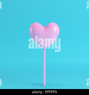 Coeur rose sur un bâton lumineux sur fond bleu pastel. Le minimalisme concept. 3D render Banque D'Images