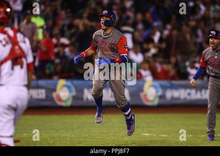 Second baseman of Puerto Rico, Javier Baez (R) makes Yurendell de