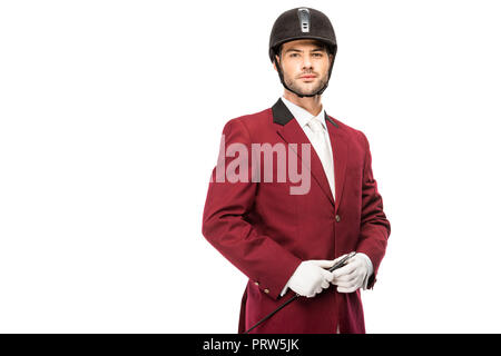 Beau jeune cavalier en uniforme et casque looking at camera isolated on white Banque D'Images