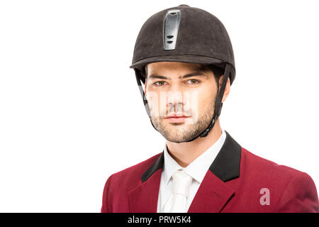 Close-up portrait of handsome jeune cavalier en uniforme et casque looking at camera isolated on white Banque D'Images