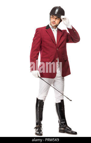 Beau jeune cavalier en tenue uniforme horseman stick et à l'écart isolated on white Banque D'Images