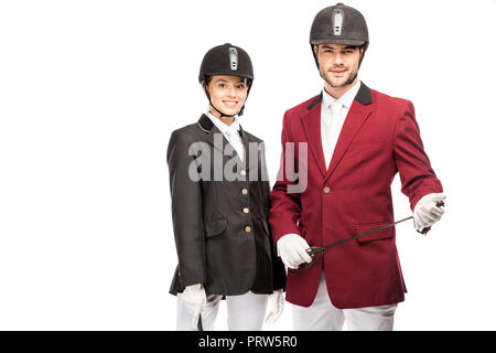 Jeunes cavaliers en uniforme et casques looking at camera isolated on white Banque D'Images