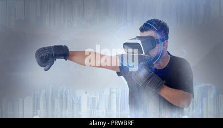 Jeune Guy en t-shirt noir regardant par VR (réalité virtuelle) lunettes - Boxe en métaverse Banque D'Images
