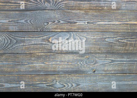 Arrière-plan de texture en bois avec des restes de peinture grise. L'horizontale. Banque D'Images