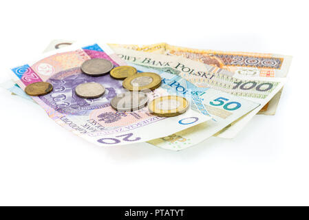 Polish zloty billets de banque, argent, monnaie de Pologne isolé sur blanc. Différents projets de papier polonais et polonais pose des pièces au hasard sur fond blanc Banque D'Images