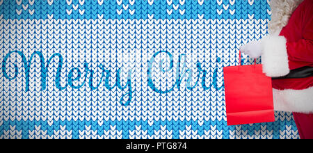 Image composite de Père santa avec un sac shopping Banque D'Images