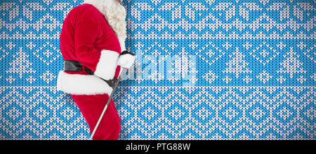 Image composite du père noël ski festif Banque D'Images