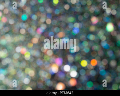 Beau bokeh bulle. Paillettes holographique brouillée sur fond noir. L'art abstrait multicolor glitter bokeh background. Banque D'Images