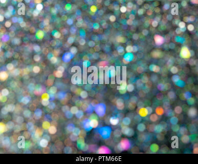 Beau bokeh bulle. Paillettes holographique brouillée sur fond noir. L'art abstrait multicolor glitter bokeh background. Banque D'Images