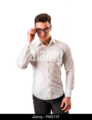 Dorky mais fit young man in studio shot Banque D'Images