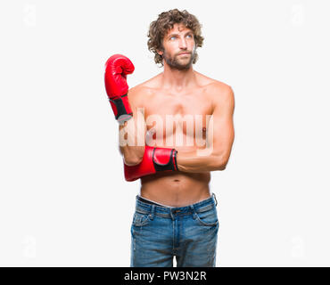 Handsome young man wearing boxing gloves boxer sur fond isolé { cocoartf ansiansicpg1tf12521404cocoasubrtf470 Banque D'Images