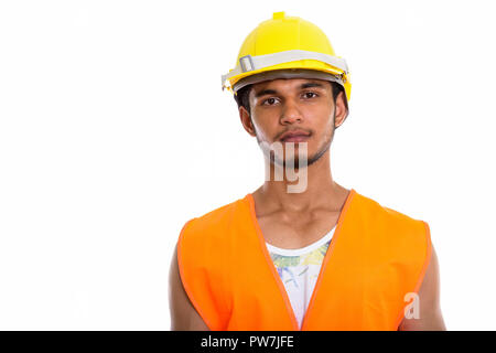 Studio shot of young handsome Indian man construction worker Banque D'Images