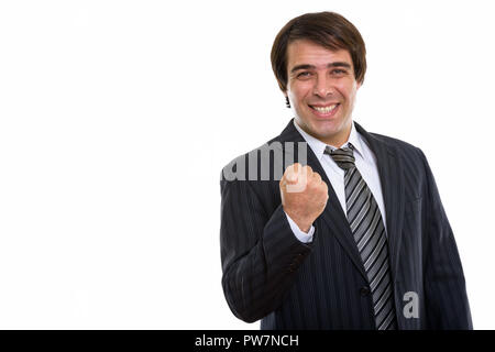 Studio shot of young businessman smiling persan heureux tandis que loo Banque D'Images