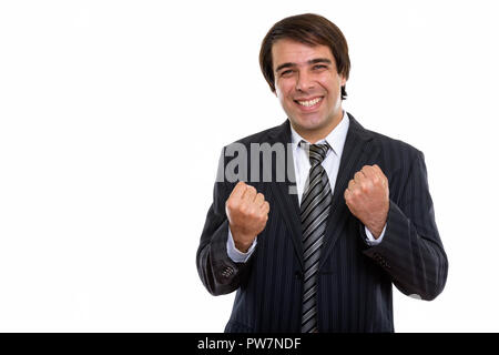 Studio shot of young businessman smiling persan heureux tandis que loo Banque D'Images