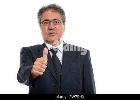 Studio shot of senior woman persane giving thumb up Banque D'Images