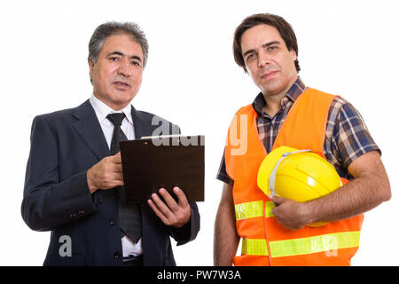 Studio shot of Persian senior businessman holding clipboard avec Banque D'Images